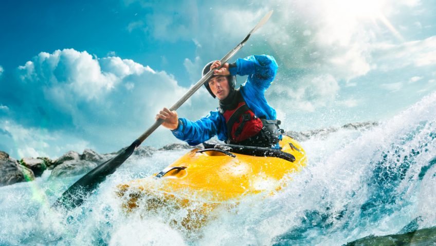 kayak and kayaker on water wave