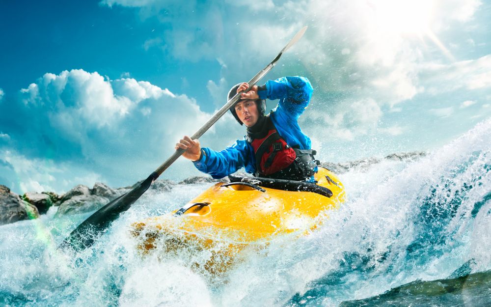 kayak and kayaker on water wave