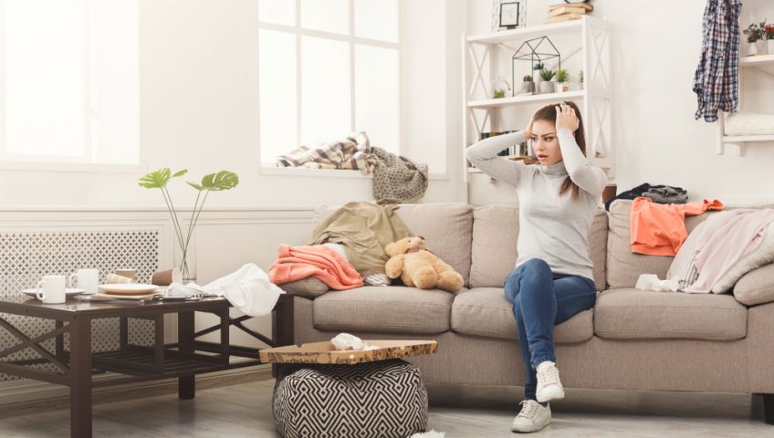 frustrated woman in messy home
