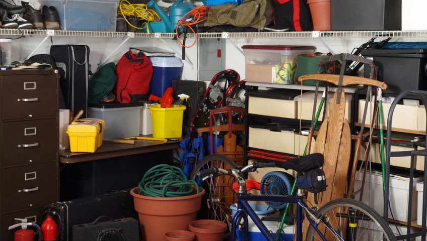 cluttered garage that someone is storing all their seasonal items in