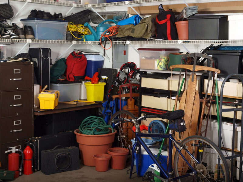 cluttered garage that someone is storing all their seasonal items in