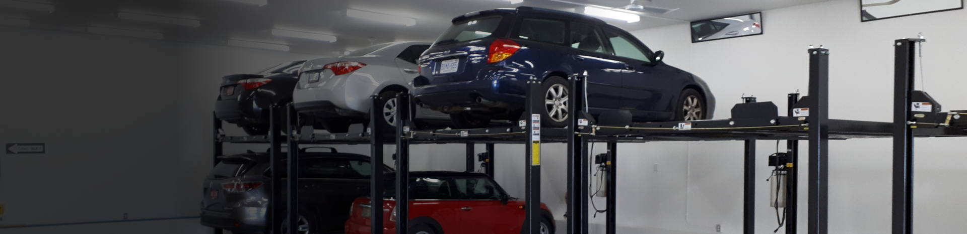 Heated indoor garage vehicle parking lifts